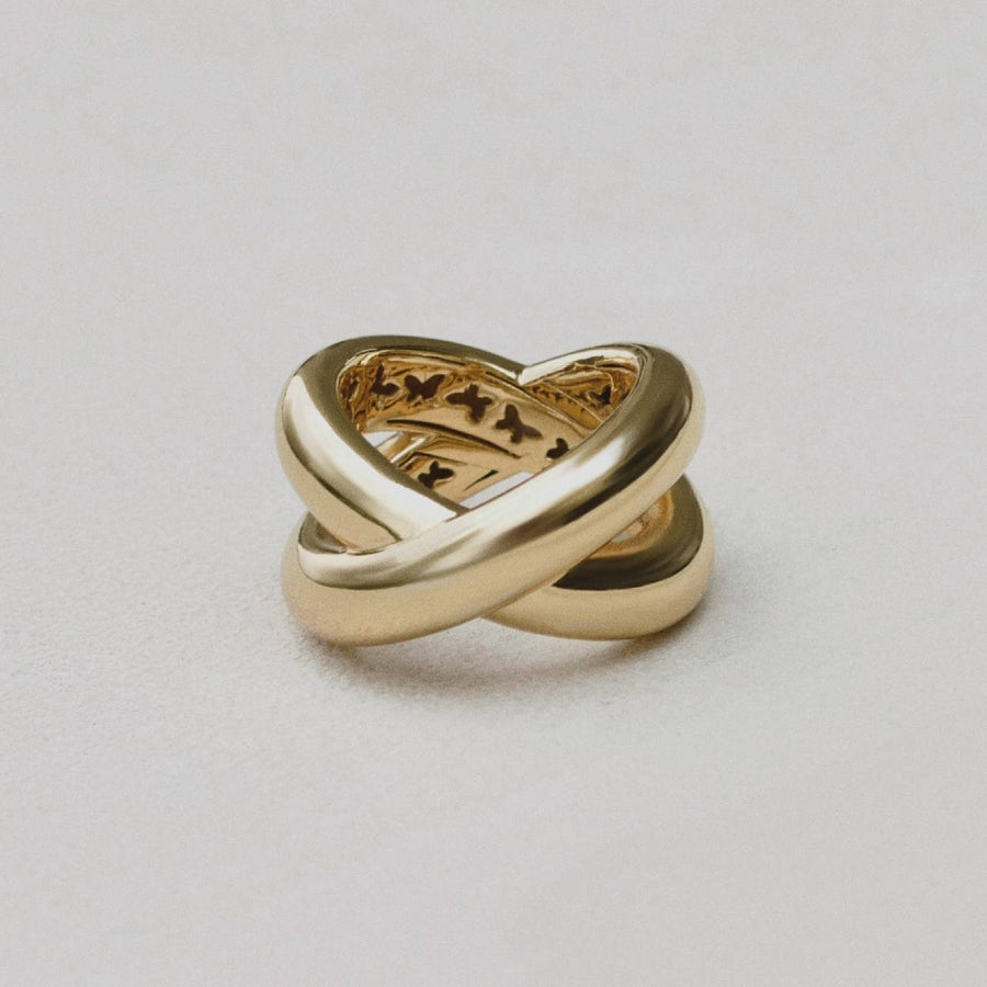 18-carat gold plated ‘Infinite Flow’ ring showcasing a sleek infinity shape and contemporary design.